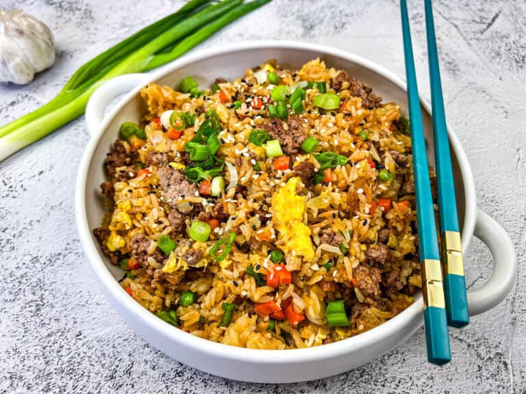Ground beef fried rice served in a white bowl.