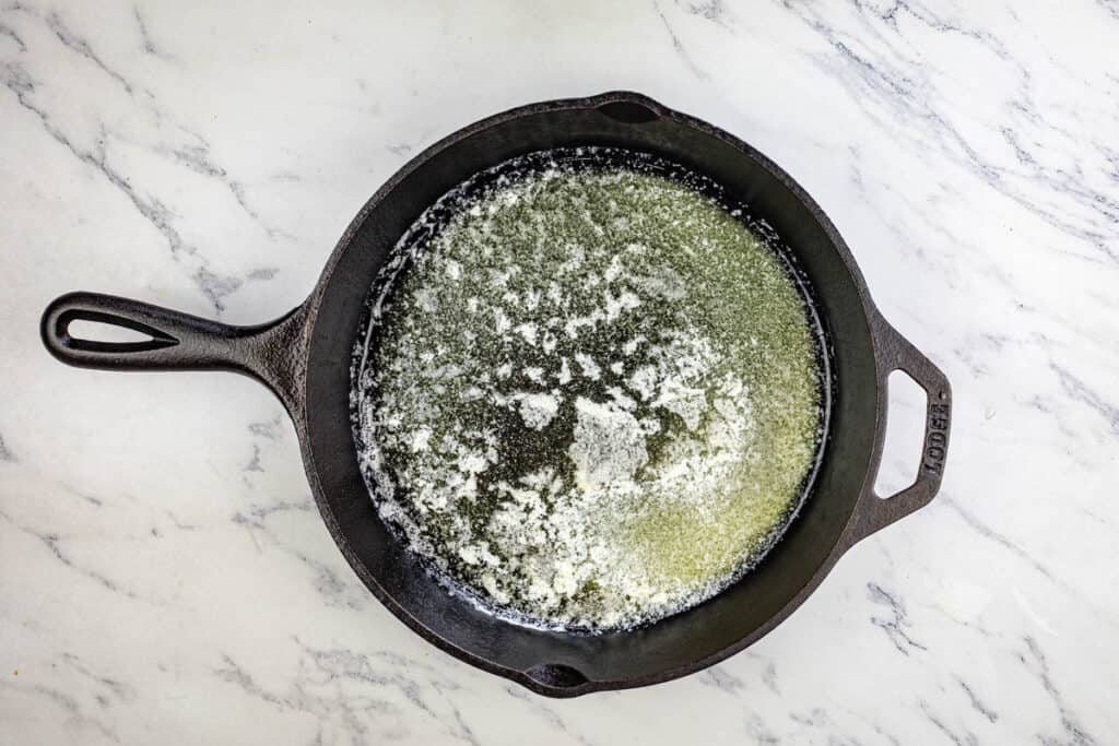 Melt the butter in a 9-inch round cake pan over medium heat.