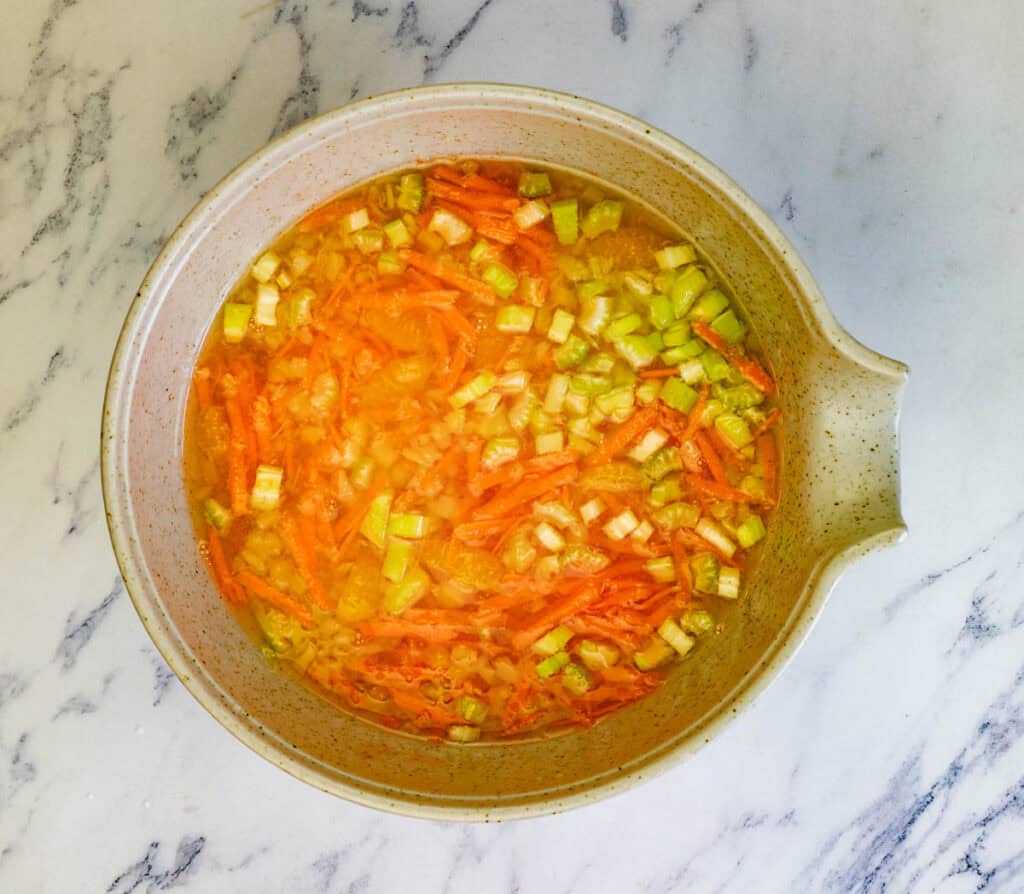 Stir in the crushed pineapple (with juice) and the shredded carrots.