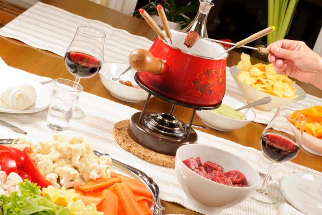 Fondue bourguignonne on a table.