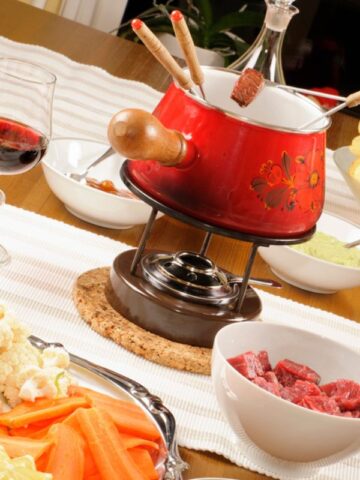 Fondue bourguignonne on a table.