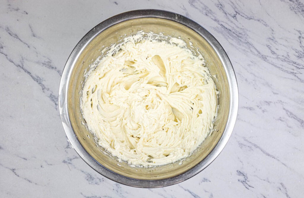 Beat cream cheese and 1/2 cup sugar until smooth and creamy.