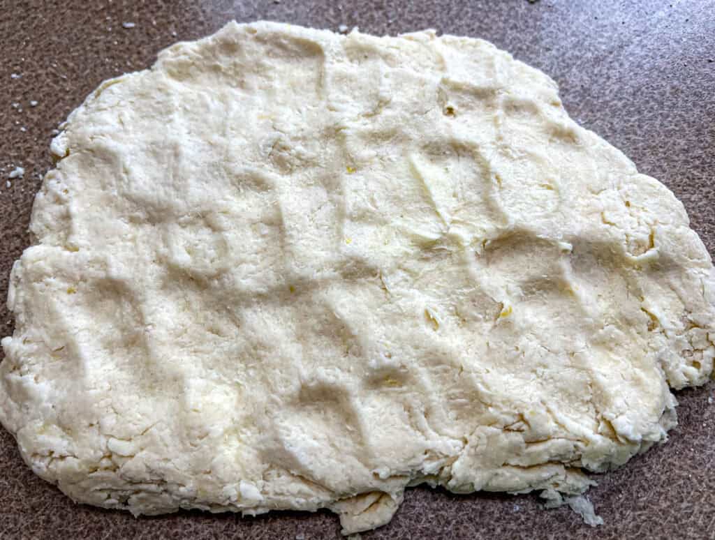 Pat the dough into a rectangle about 1-inch thick.