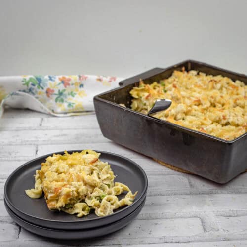 Classic Tuna Noodle Casserole on a tray and black plate.