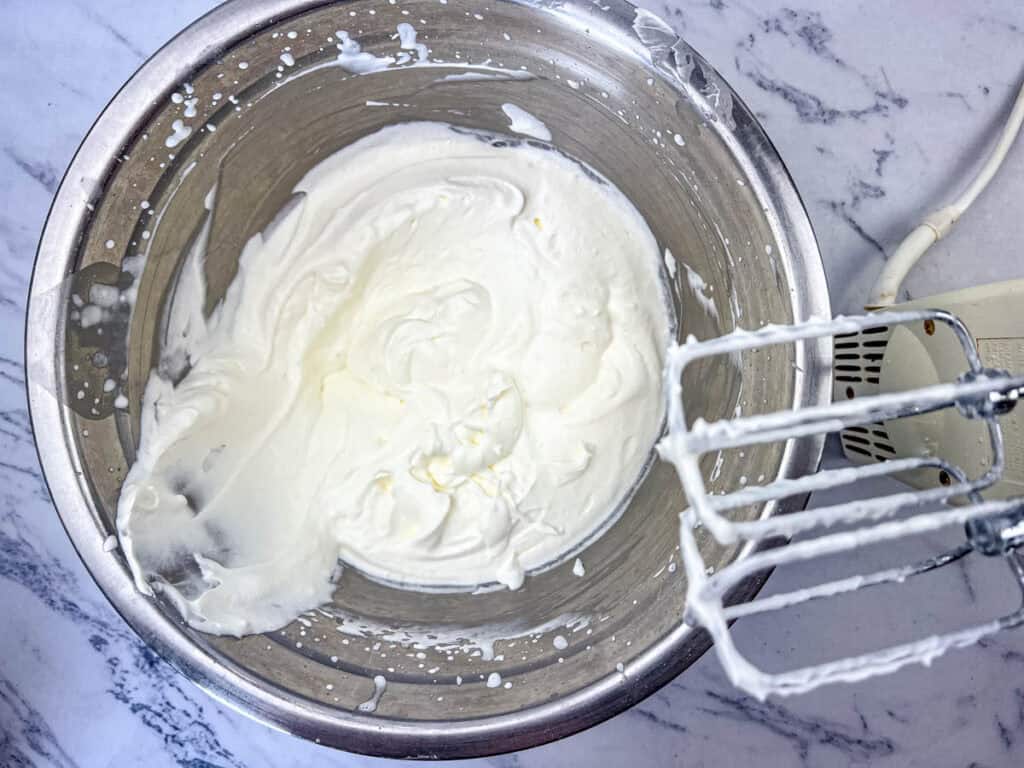 Place heavy whipping cream and the remaining 1/4 cup powdered sugar.