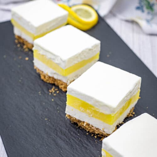 Pieces of lemon lush on a slate plate.