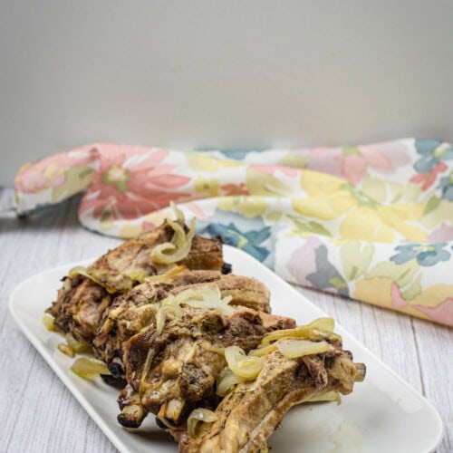 Oven Baked Ribs on a white plate.