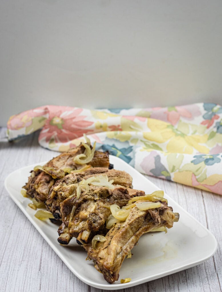 Oven Baked Ribs on a white plate.