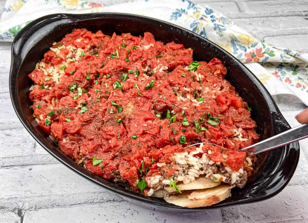 Shipwreck casserole on a black casserole dish.