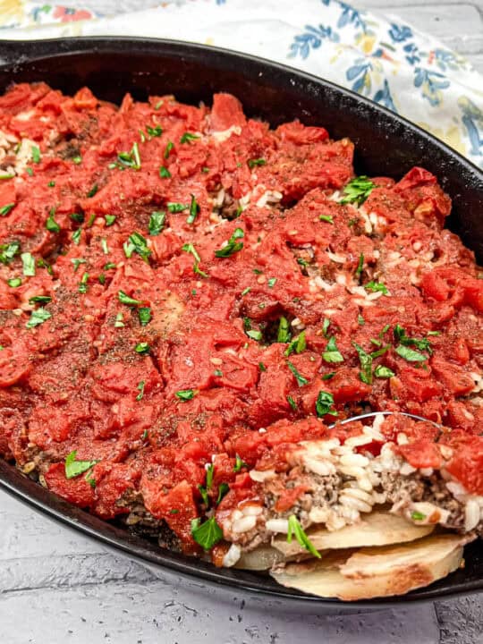 Shipwreck casserole on a black casserole dish.