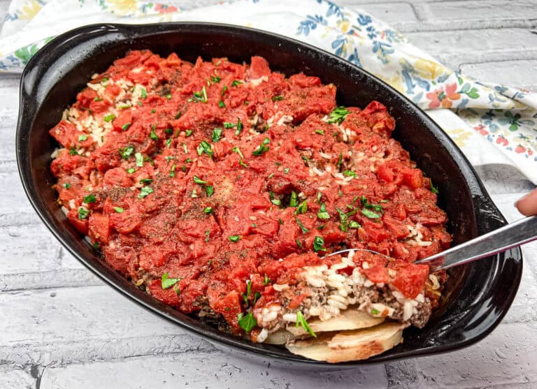Shipwreck casserole served in a black casserole dish.