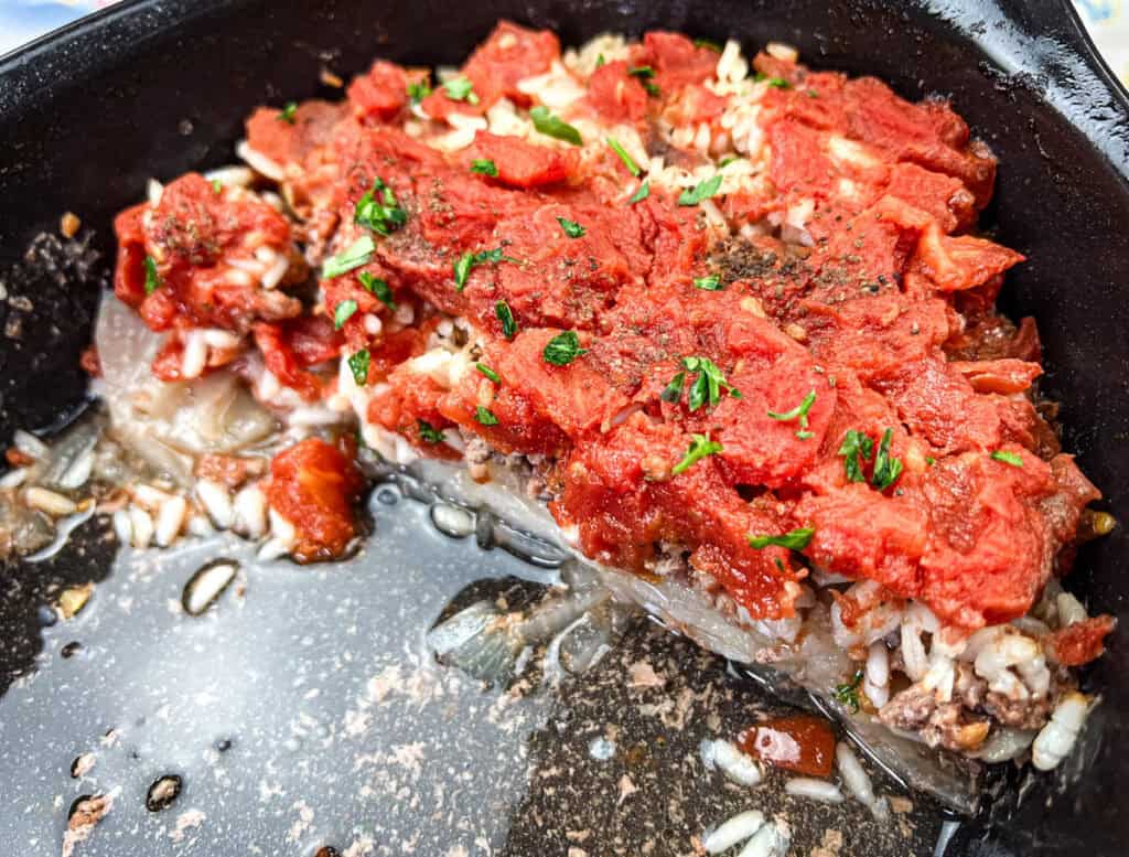 Half portion of the Shipwreck casserole on a casserole dish.