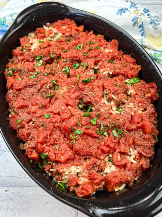 Shipwreck casserole on a black casserole dish.