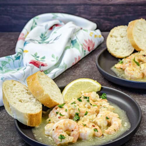 A plate of Shrimp Scampi on a table.