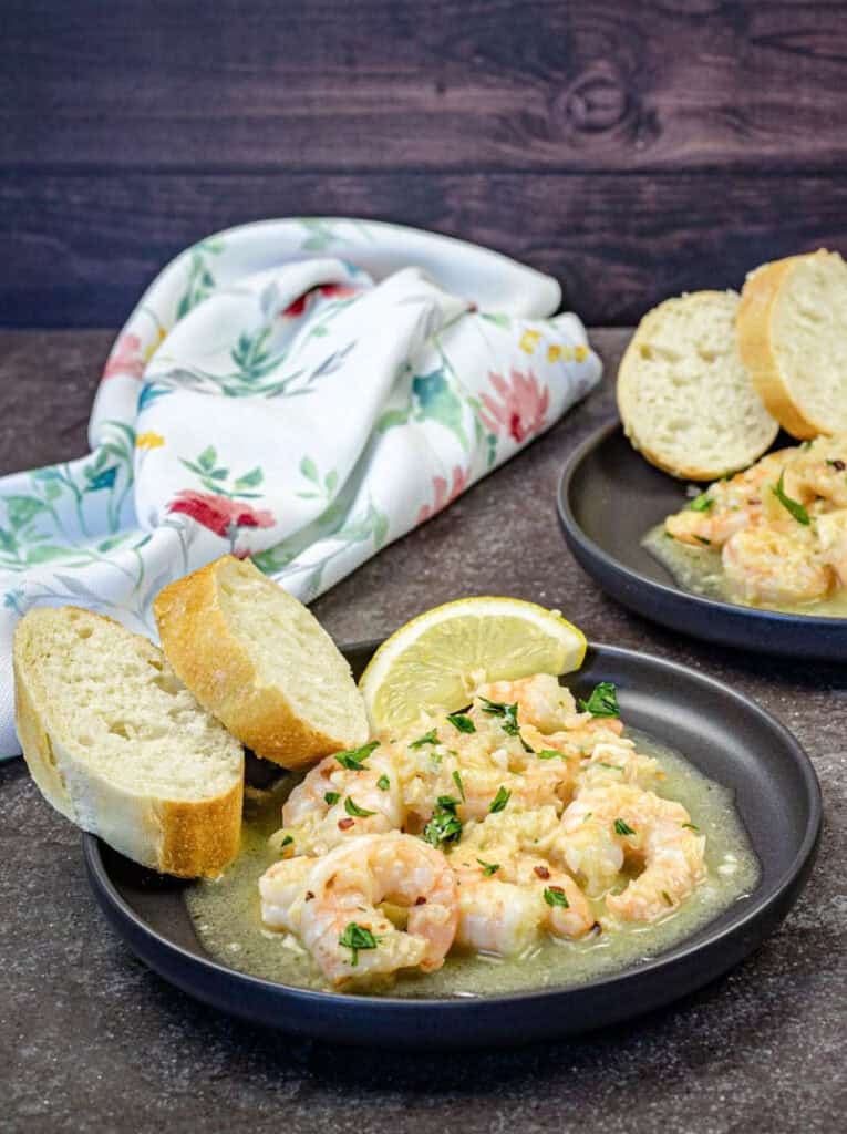 A plate of Shrimp Scampi on a table.