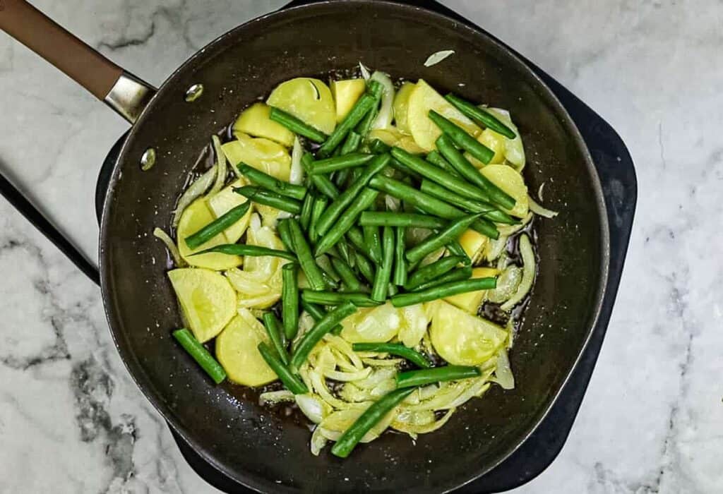 Add the trimmed and cut green beans.