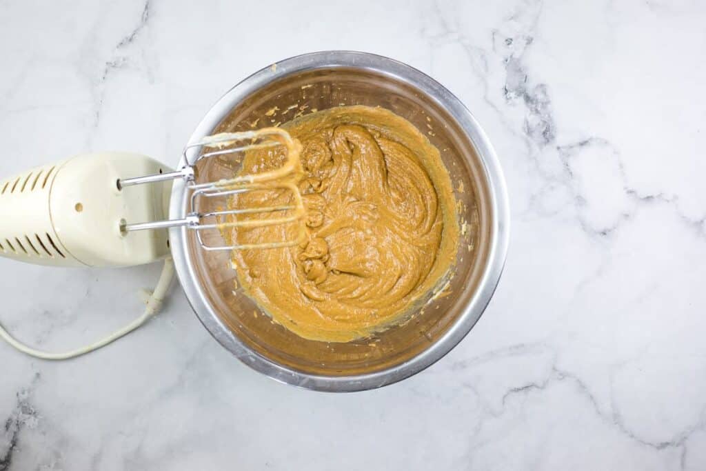 Mixing peanut butter and honey.