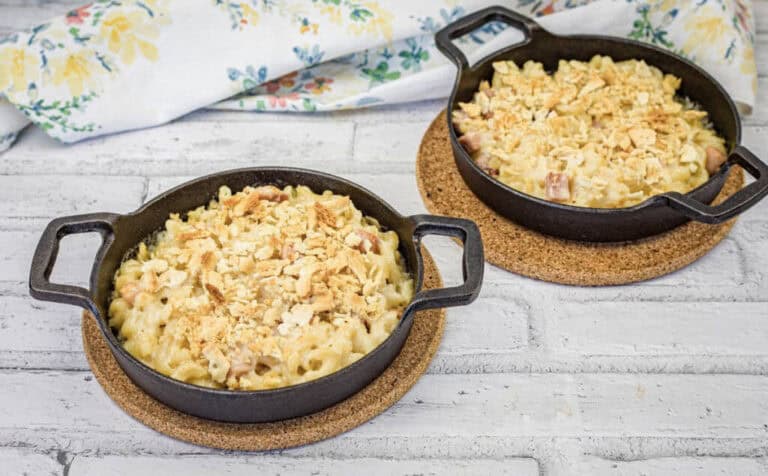 Mac and cheese served in a black skillet.