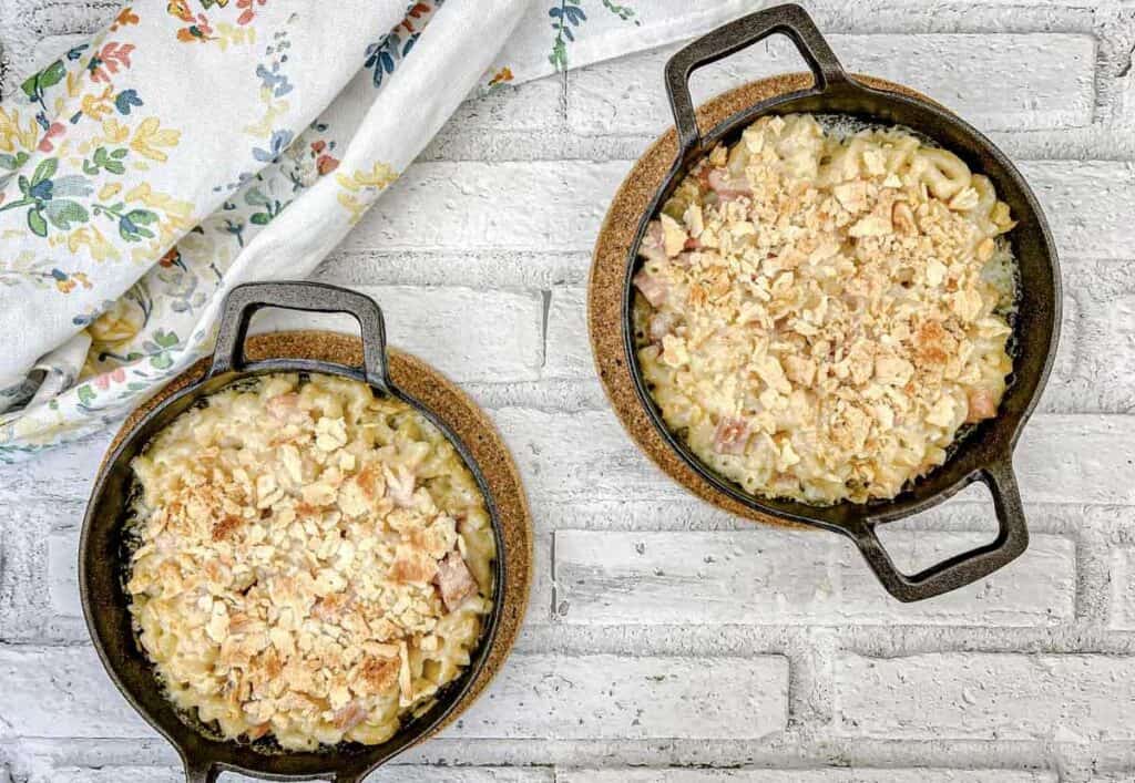 Top-down shot of mac & cheese served on a black skillet.