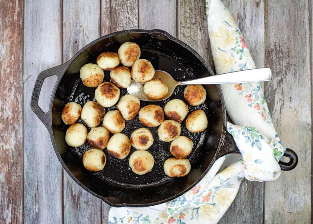 Top-down shot of Parisian potatoes on a skillet.