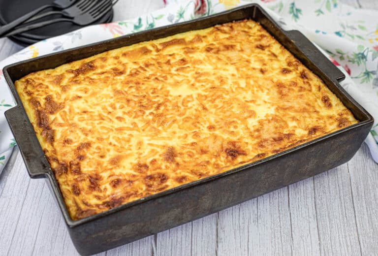 A casserole pan of pastitsio on the table.