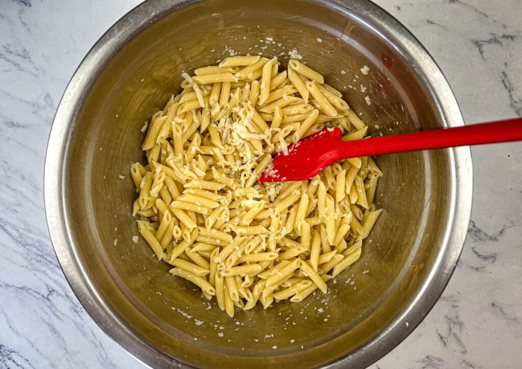 Drain pasta, then toss with butter and Parmesan cheese.