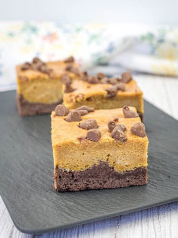 Pumpkin brownies on a slate plate.