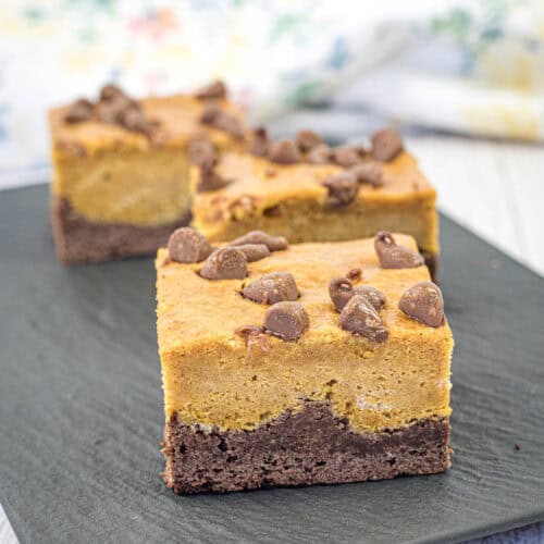 Pumpkin brownies on a slate plate.