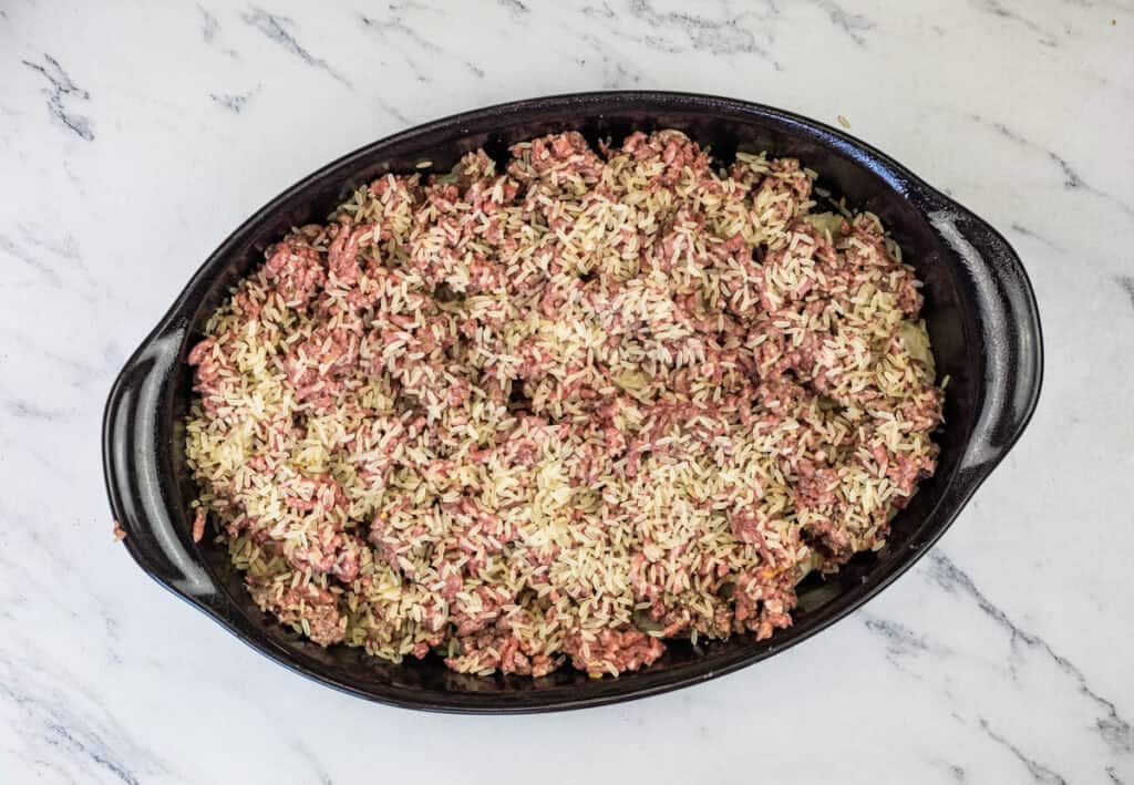 Sprinkle the rice over the top of the ground beef.