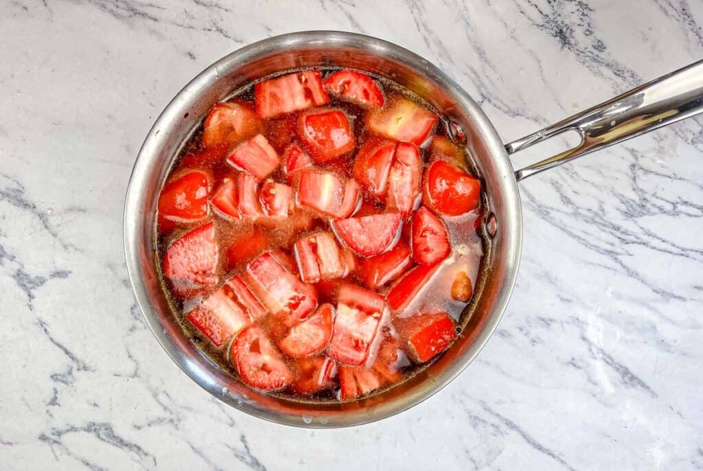 Stir in the diced tomatoes and vegetable broth.