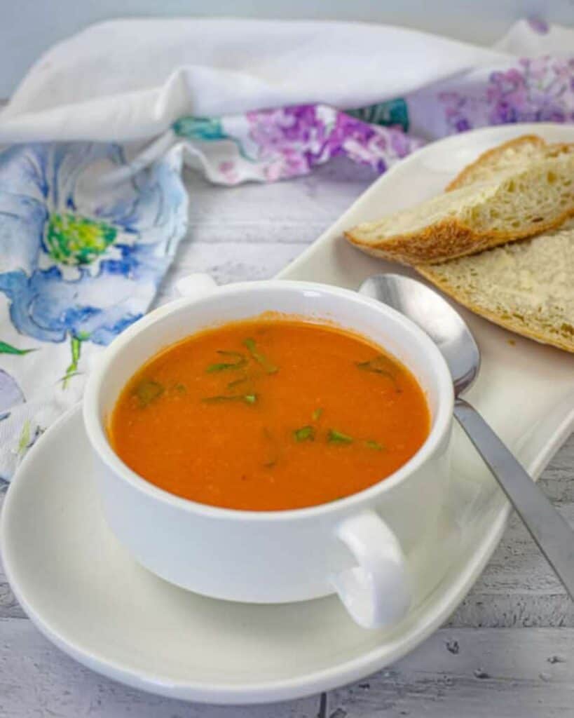 Old Fashioned Tomato Soup with a fresh basil on top.