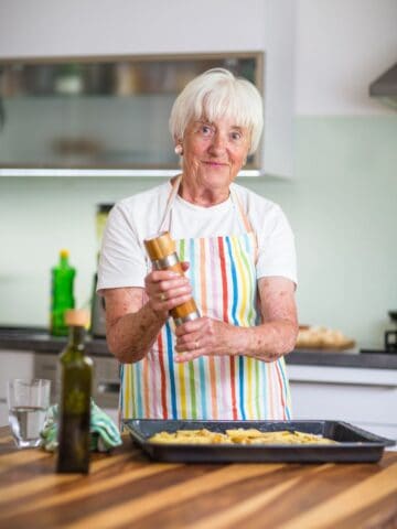 Senior woman cooking in the kitchen.