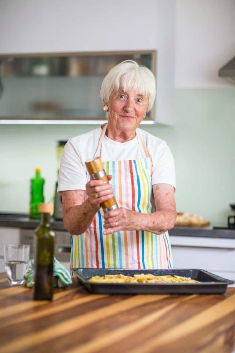 Senior woman cooking in the kitchen.