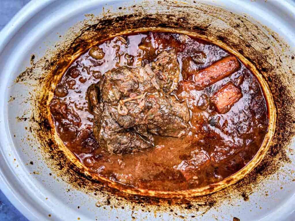 Remove the meat from the slow cooker.