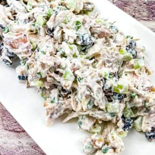 Turkey Salad with Cranberries & Walnuts on a white plate.