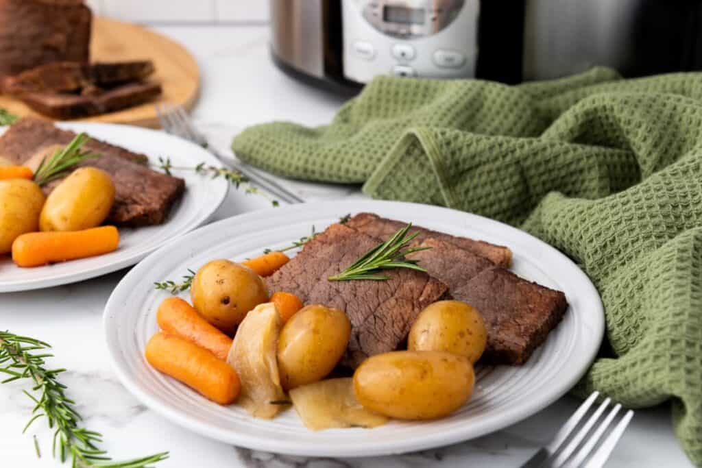 A plate of crockpot slow cooker rump roast.