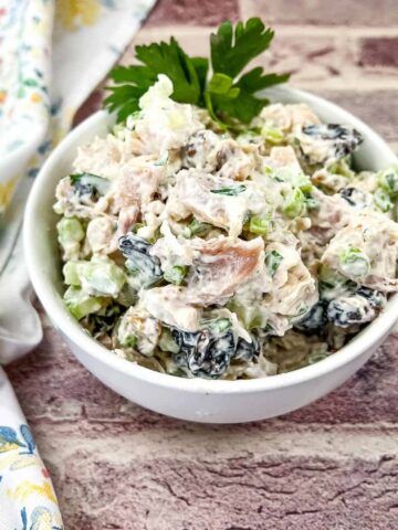 Chicken Salad with Walnuts and Cranberries in a bowl.