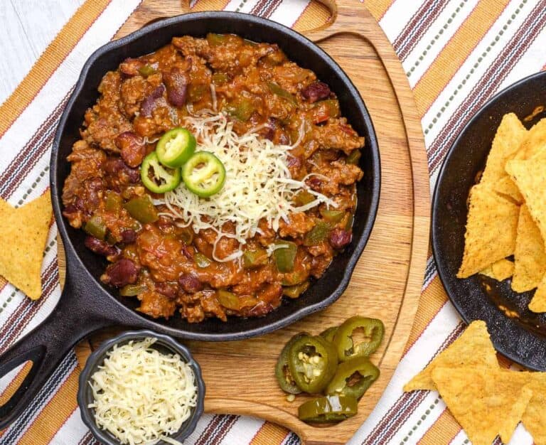 Over the Top Chili in a black cast iron bowl.