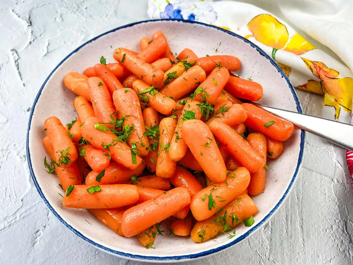 Copycat Cracker Barrel Baby Carrots in a white bowl.