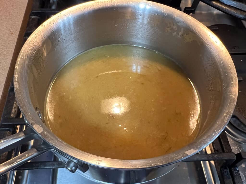 Make gravy by mixing the flour with 1/2 cup chicken broth.