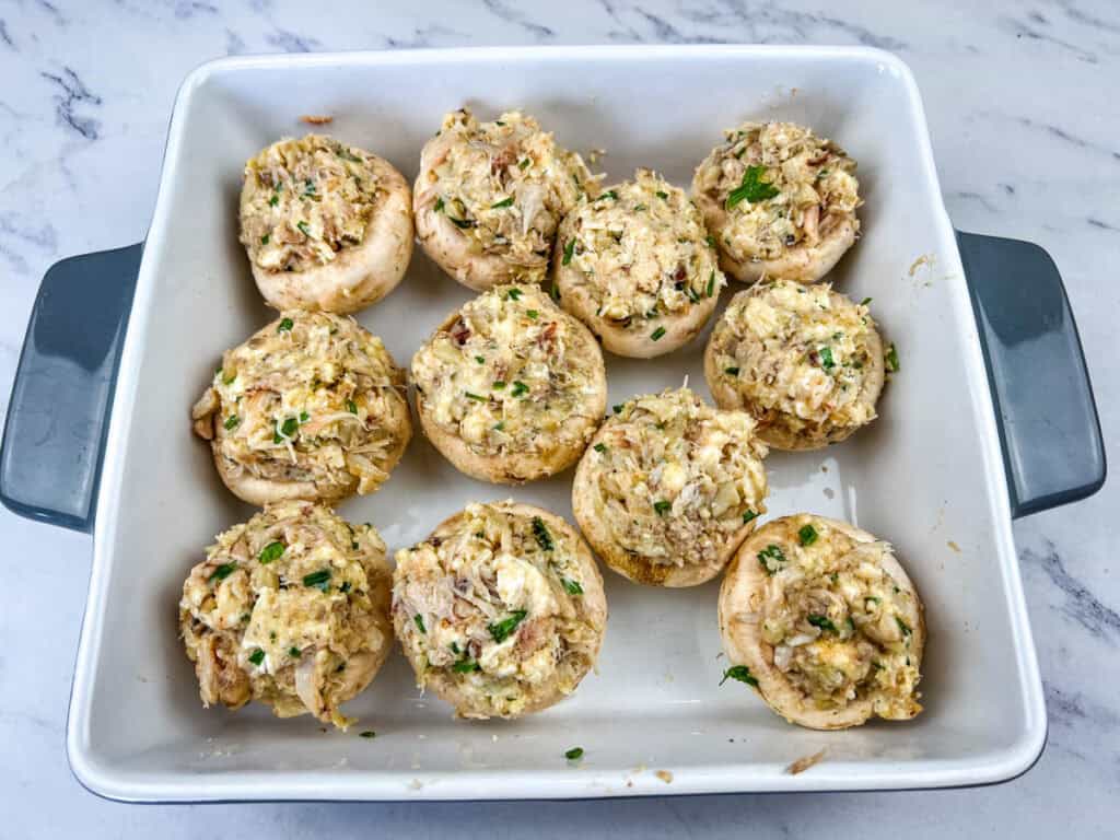 Fill each mushroom cap generously with the crab mixture.