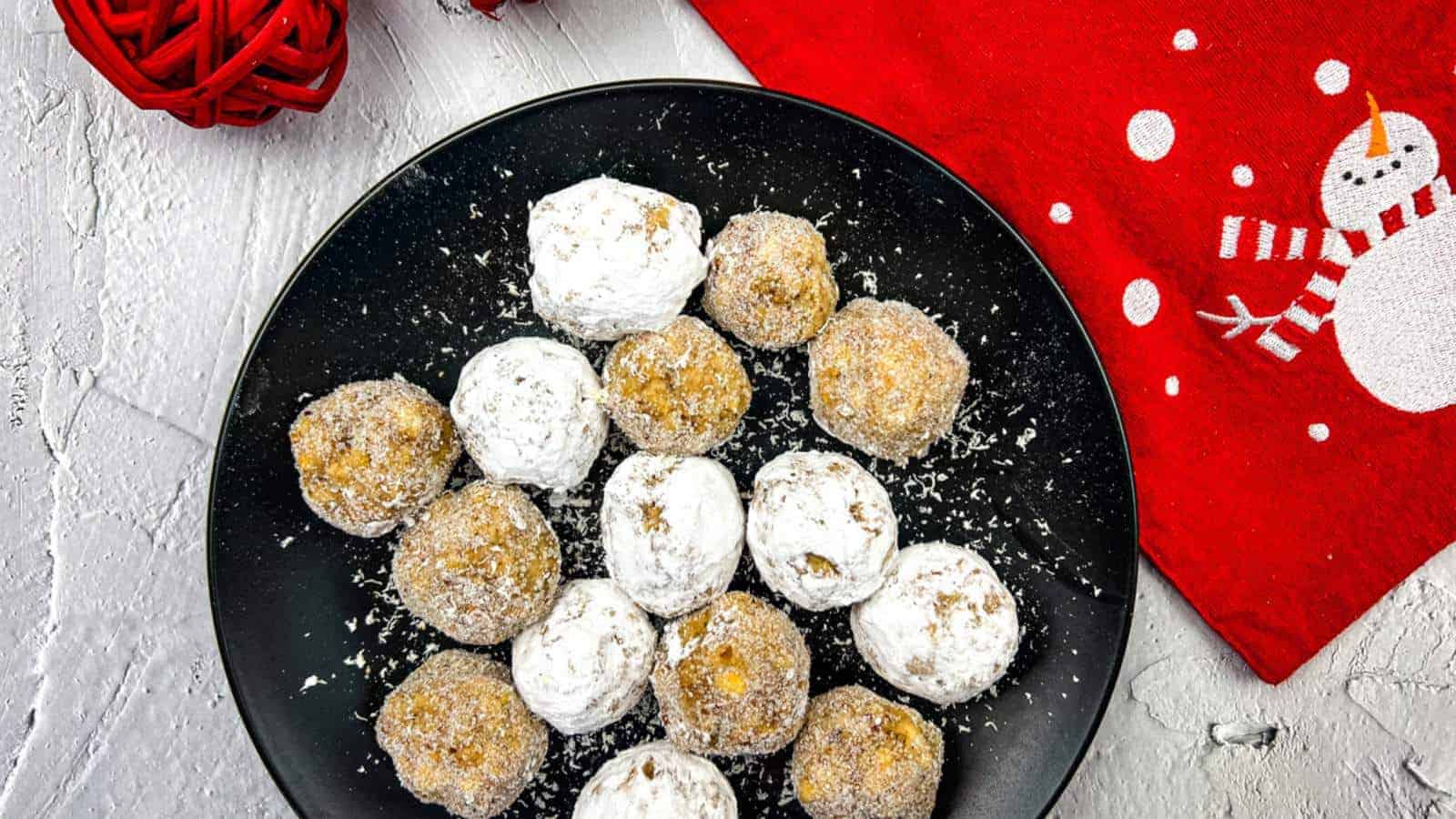 Bourbon balls with white chocolate and powdered sugar.