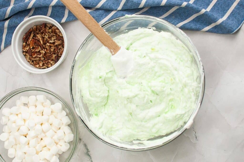 Cool whip and pudding mixture evenly combined in a bowl.