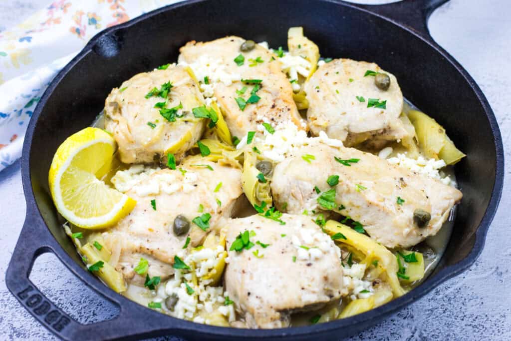 https://southernsupperclub.com/wp-content/uploads/2025/02/Skillet-Chicken-with-Lemon-Artichokes-Feta-h3.jpg