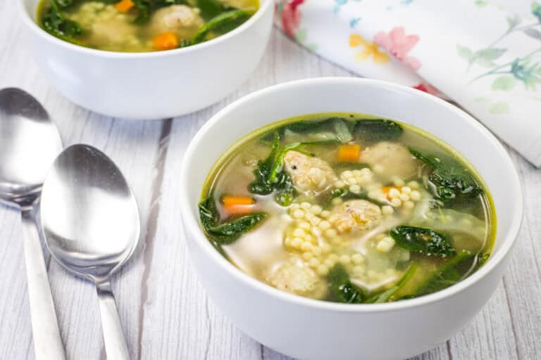 Two bowls of Italian wedding soup.