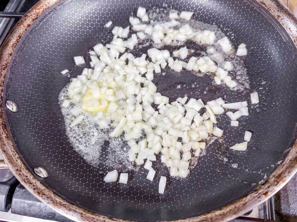 melted butter and seared onions in a skillet.