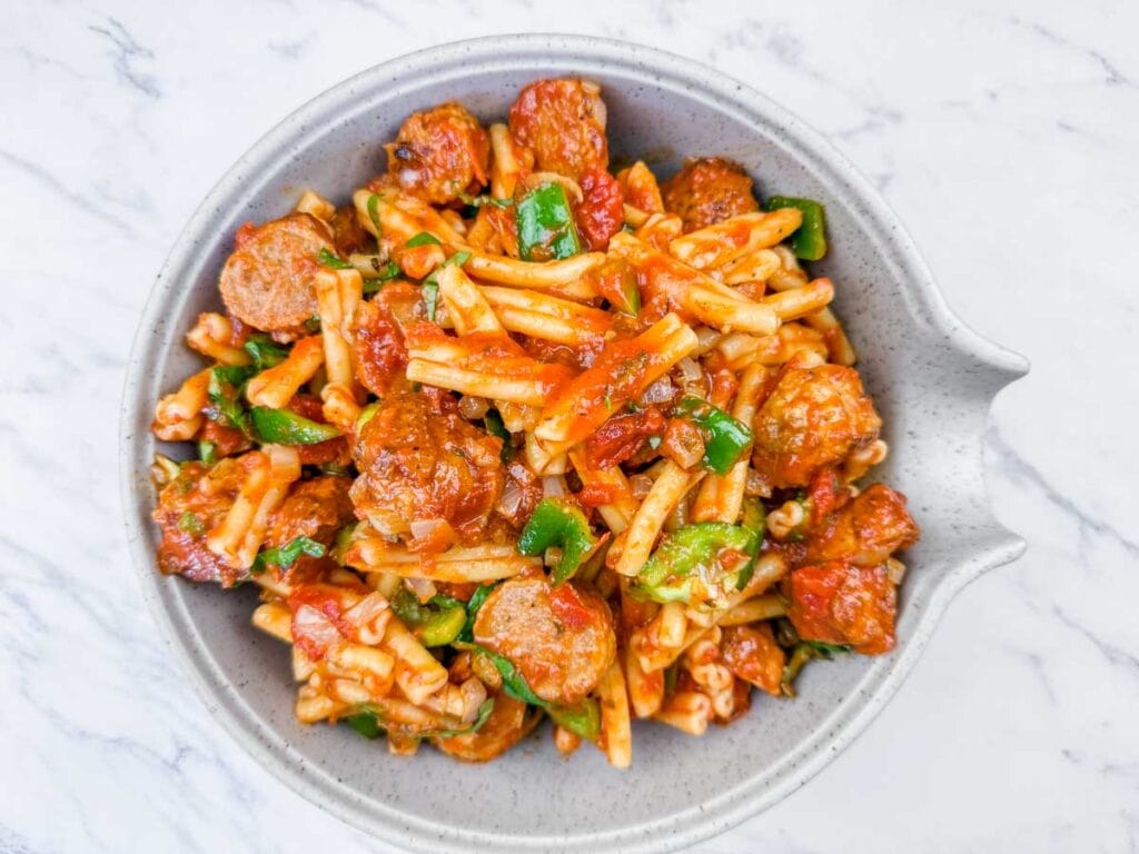 In a big mixing bowl, combine the thawed meatballs, your saut&eacute;ed veggies, and the jar of marinara sauce.