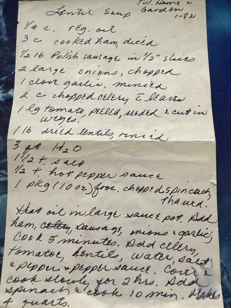 Handwritten lentil soup recipe with ingredients like ham, onions, garlic, celery, tomatoes, and lentils, followed by step-by-step cooking instructions.